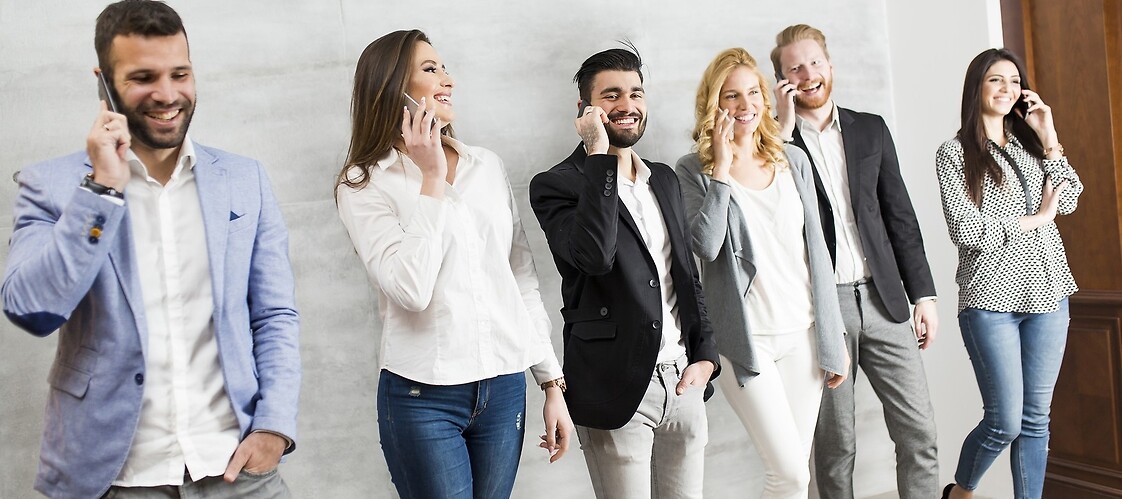 A group of people with mobile phones