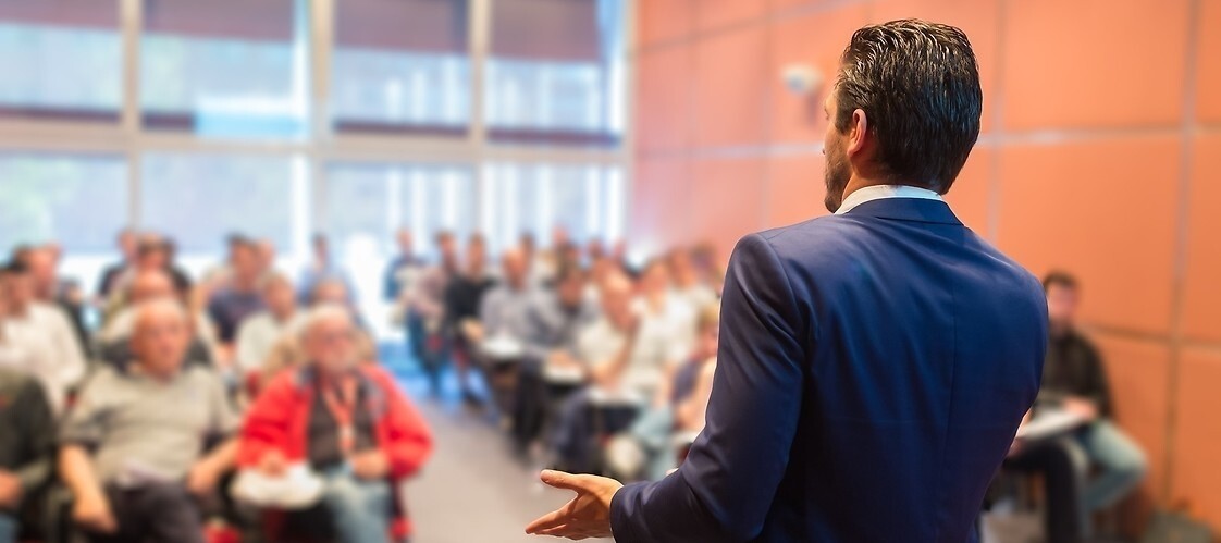 Man speaking at the conference