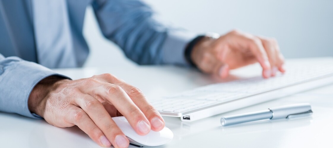 hand on computer keyboard