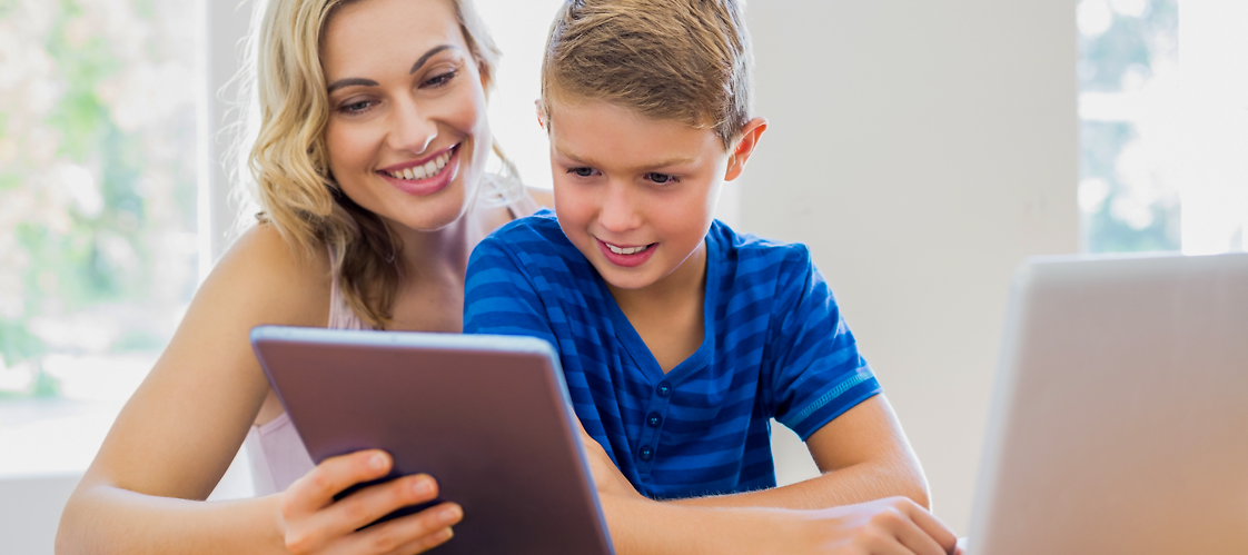 A woman and a boy with tablet